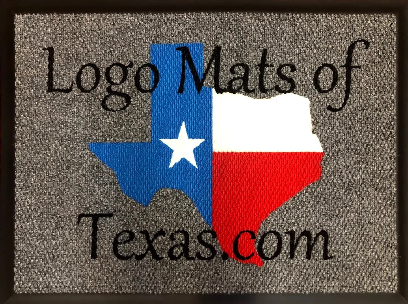 Gray mat with black Logo Mats of Texas lettering and a Texas outline filled with the red, white and blue state flag